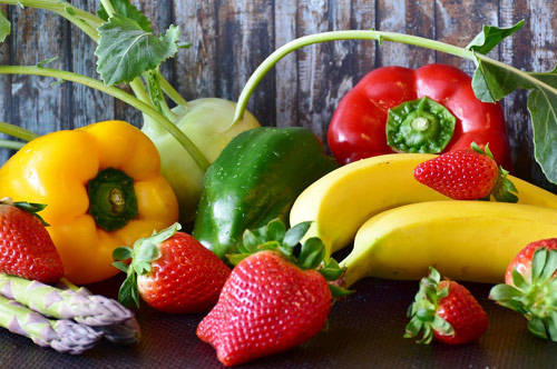 A table topped with lots of fruits and vegetables.