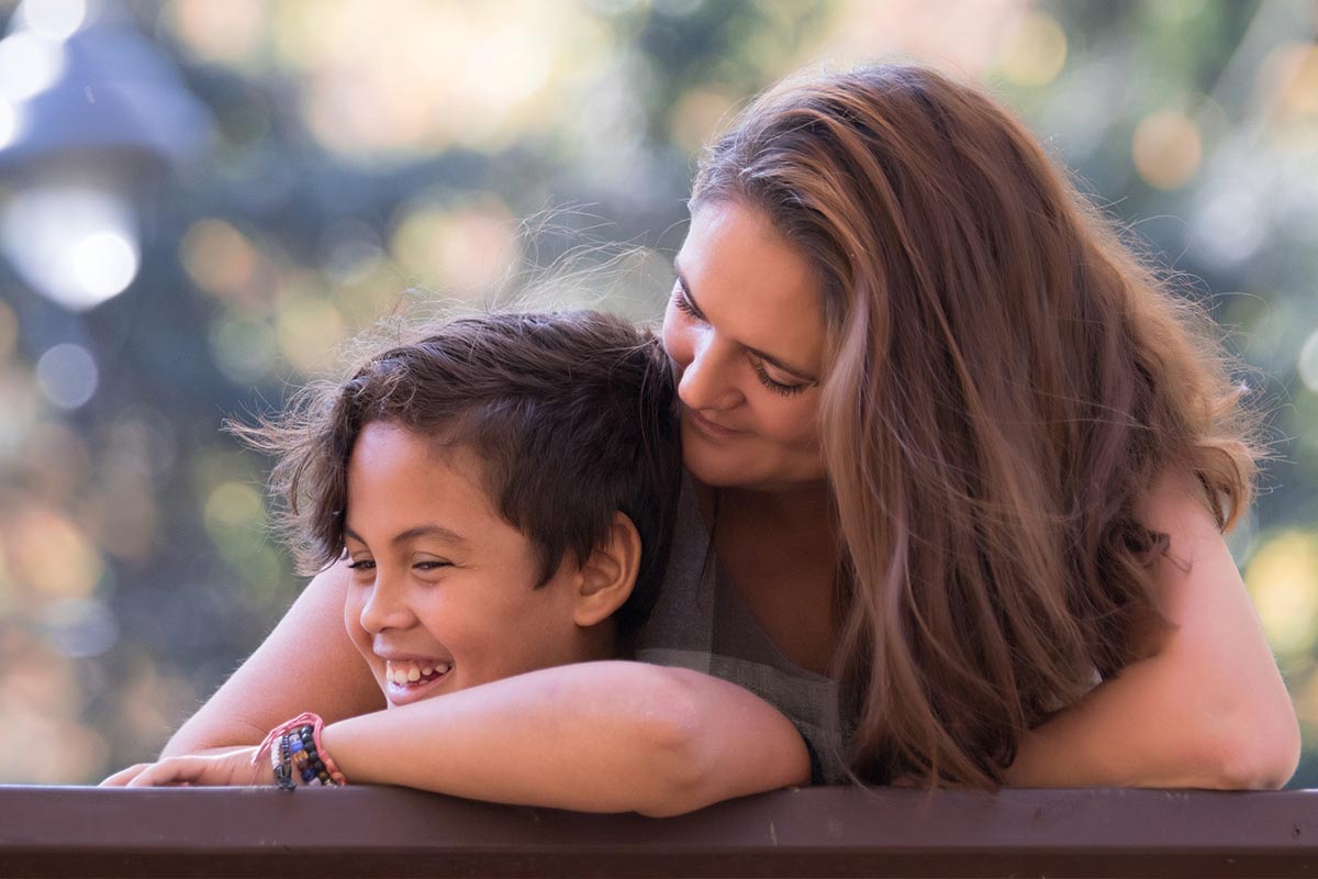 A woman and child are smiling for the camera.